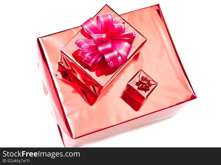 Red christmas gifts boxes with bow. Isolated on white