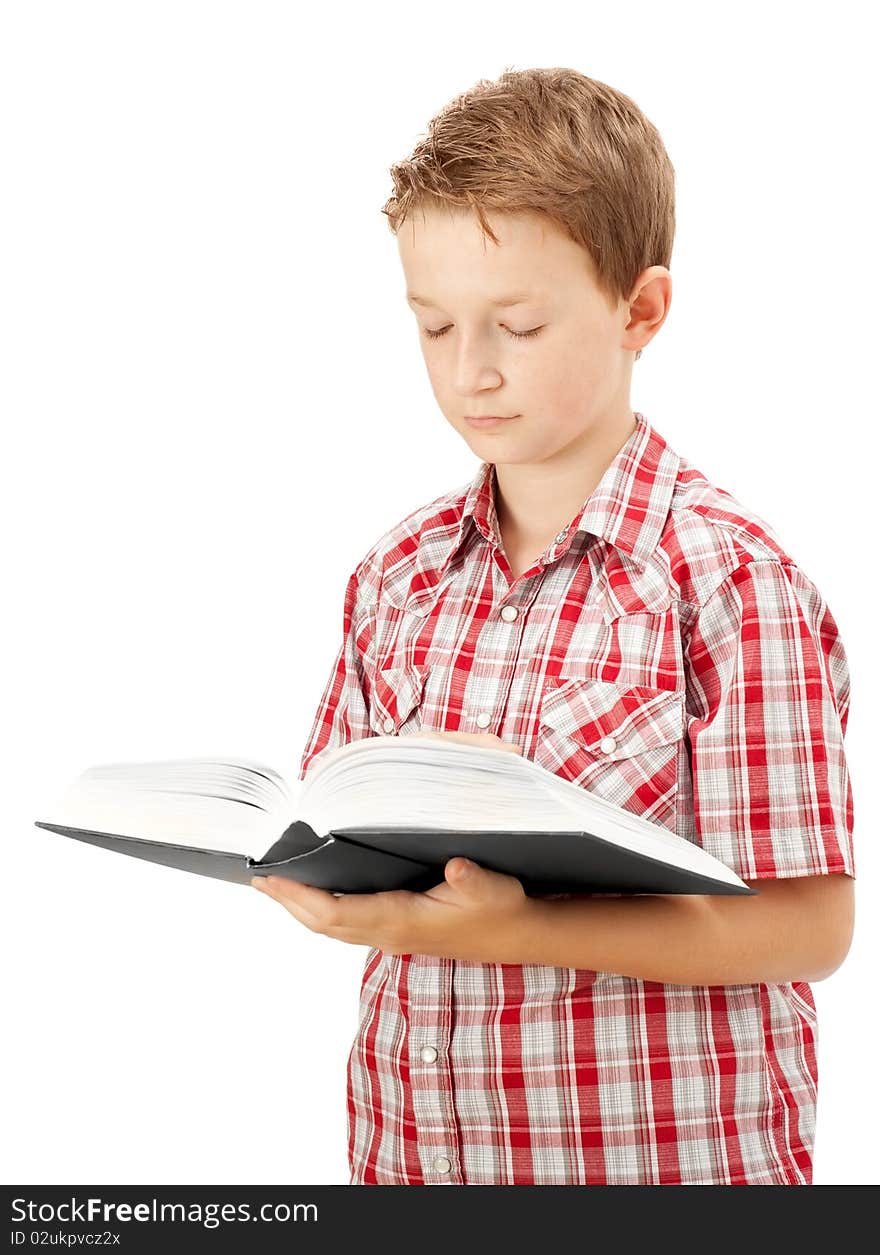 Young school boy reading a book