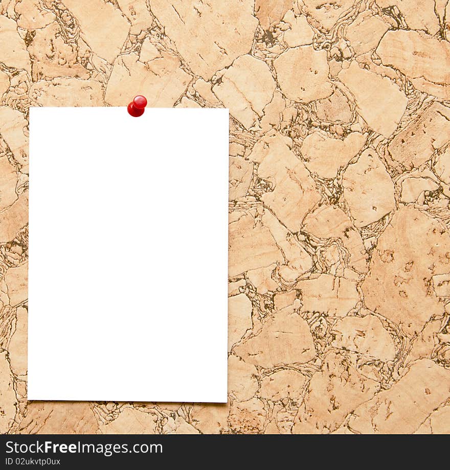 Cork board with blank note attached with thumb pin. Cork board with blank note attached with thumb pin