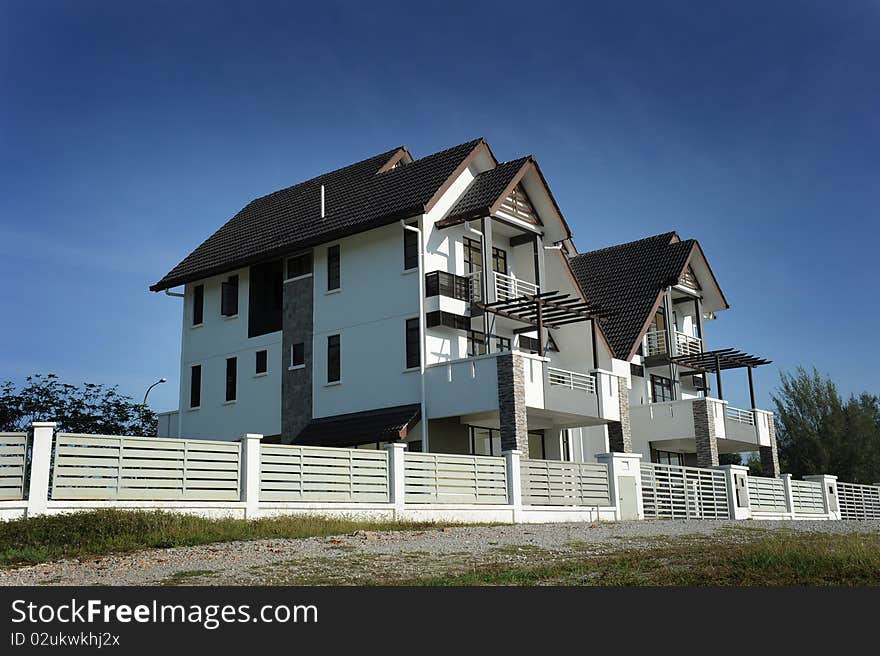 New home with Fencing on clear blue day. New home with Fencing on clear blue day.