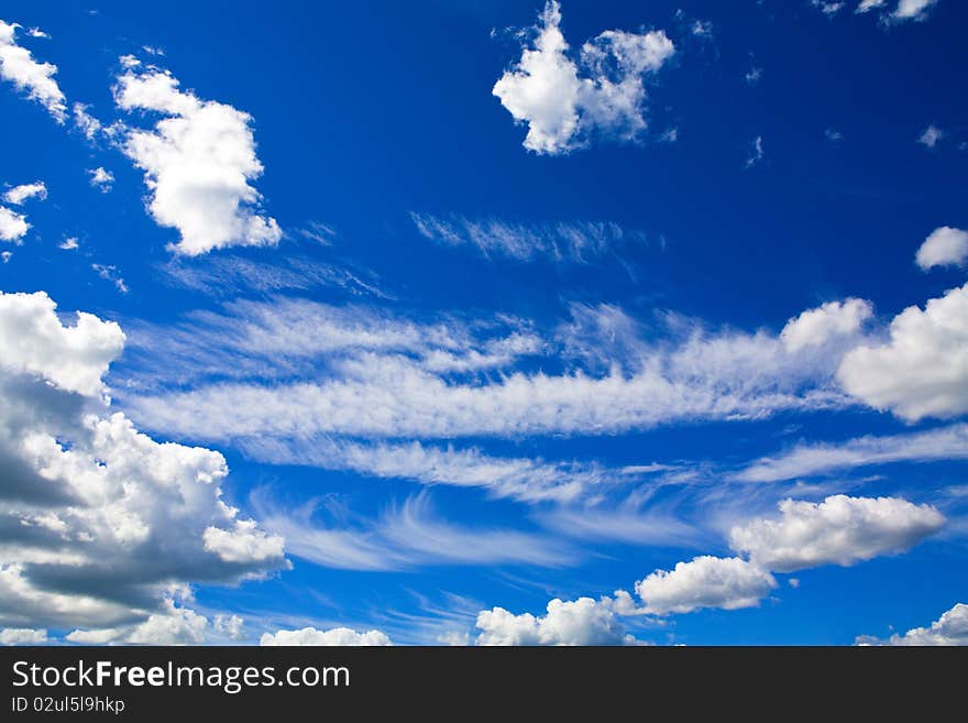 Sun shining over beautiful cumulus cloudscape in blue sky. Sun shining over beautiful cumulus cloudscape in blue sky