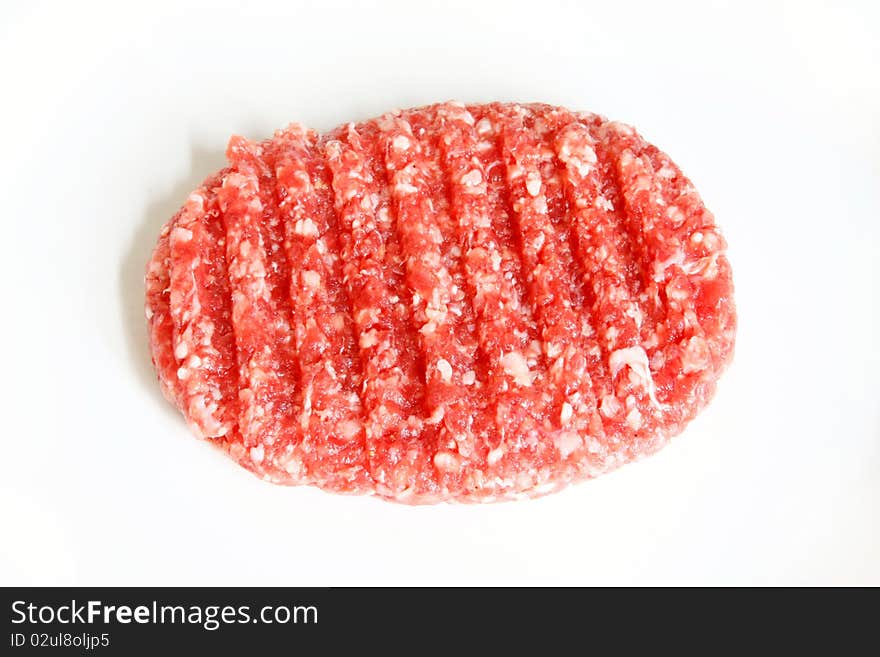 Raw hamburger on white background