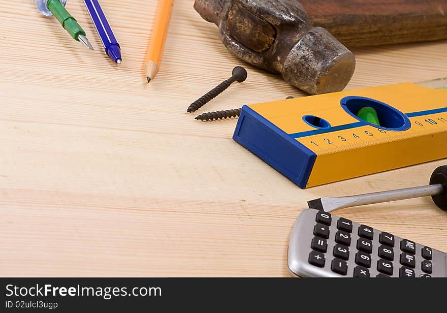 Tools and pens on wood texture