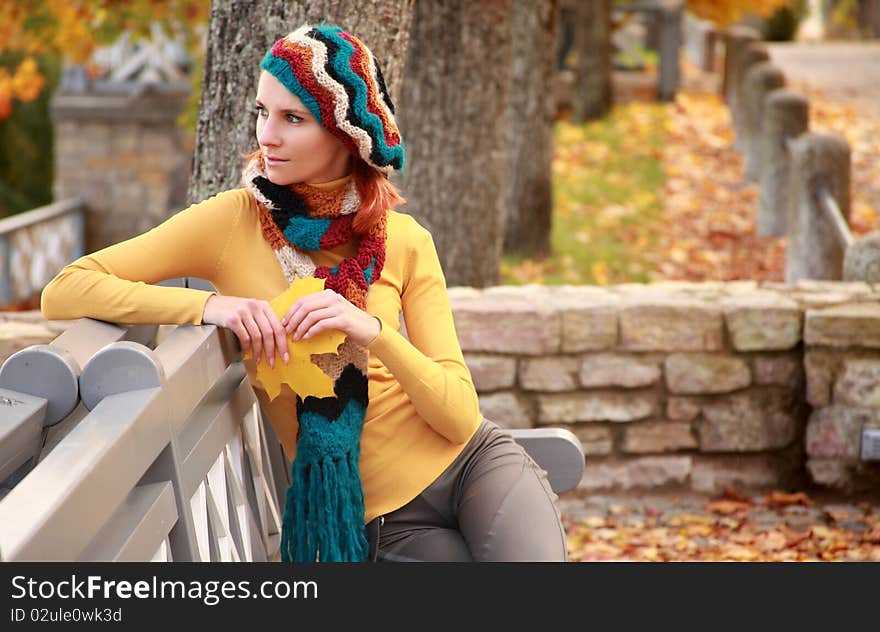 Young girl walking in autumn park. Young girl walking in autumn park