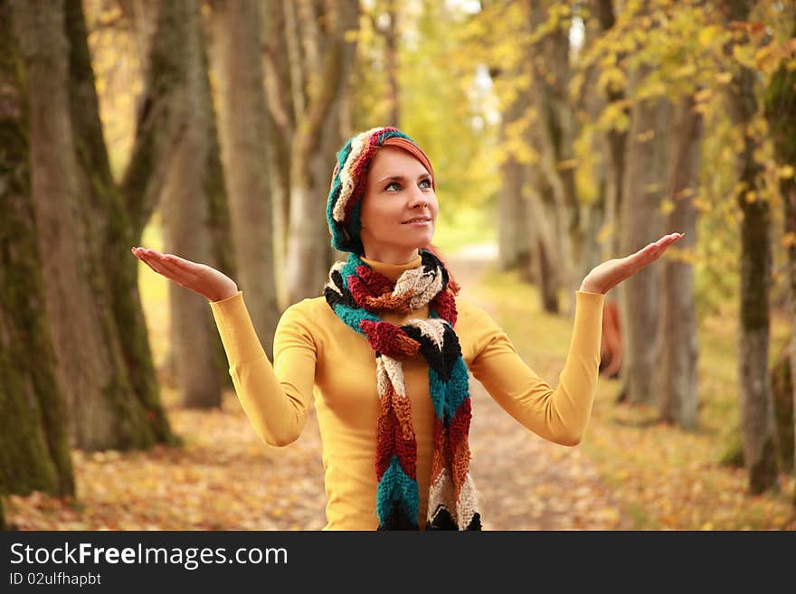 Young girl walking in autumn park. Young girl walking in autumn park