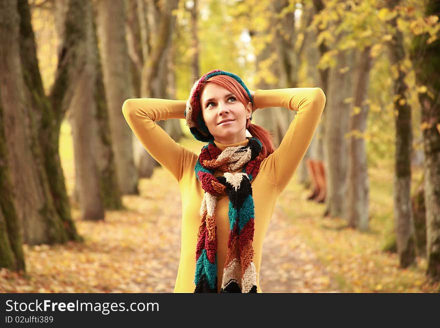 Young girl walking in autumn park. Young girl walking in autumn park