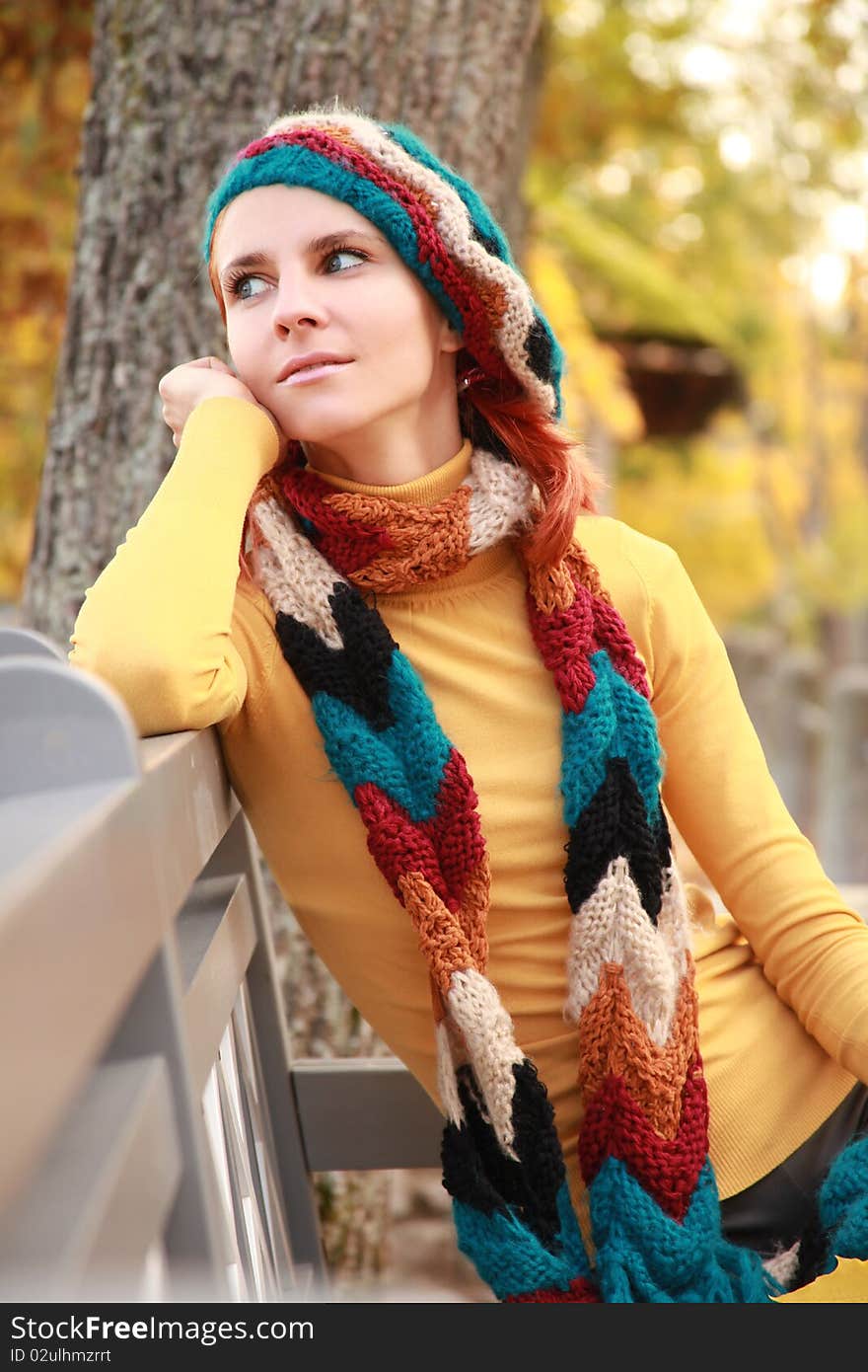 Young girl walking in autumn park