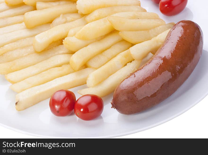 Fried potato with tomatoes and sausage on a plate.