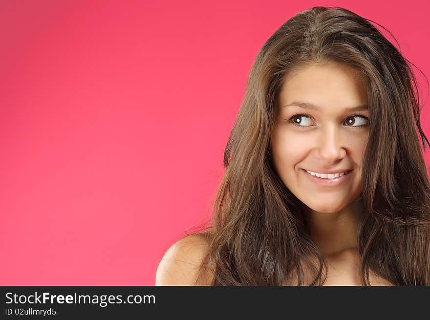 Young beautiful woman with long hair posing on vivid background. Young beautiful woman with long hair posing on vivid background