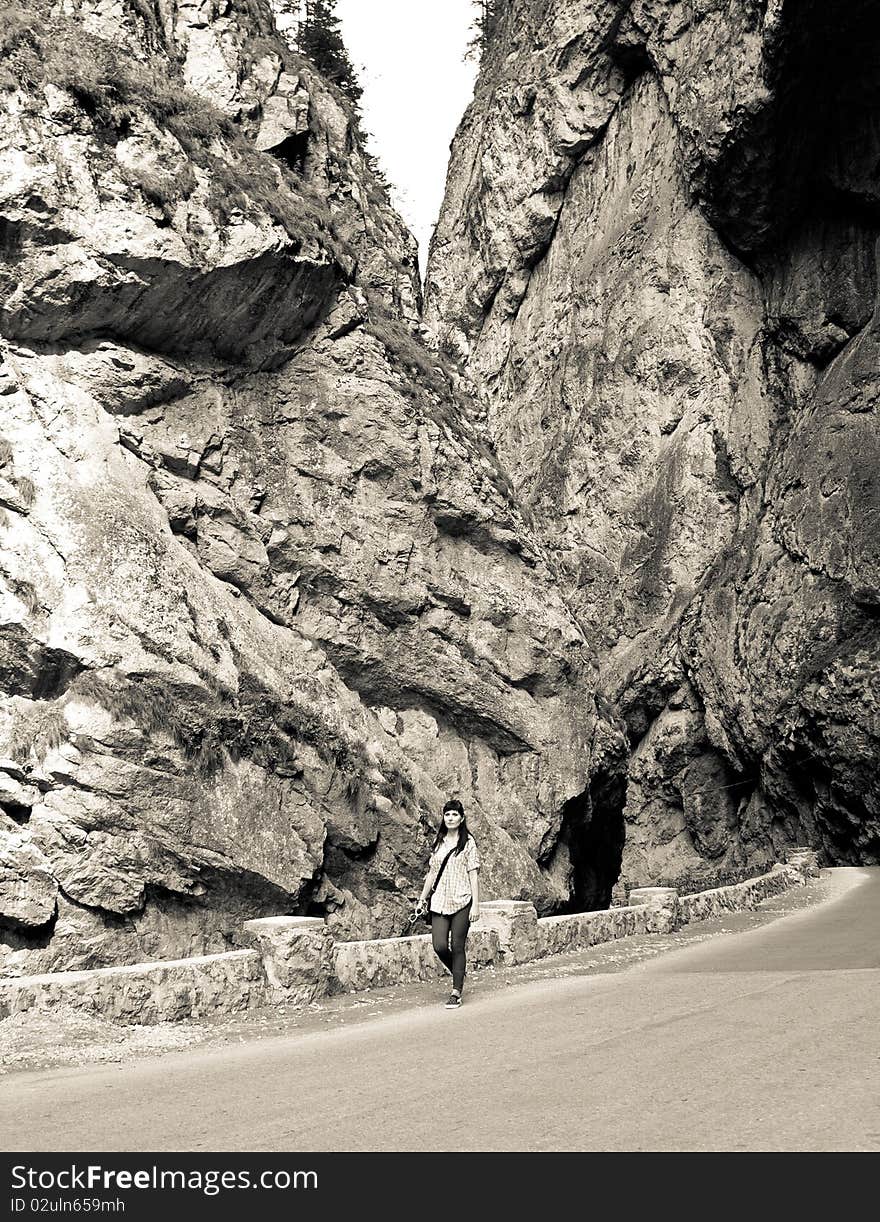 Woman walking on a mountain road. Woman walking on a mountain road