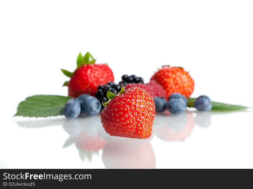 Fresh Berries - Focus is on the Strawberry in the foreground