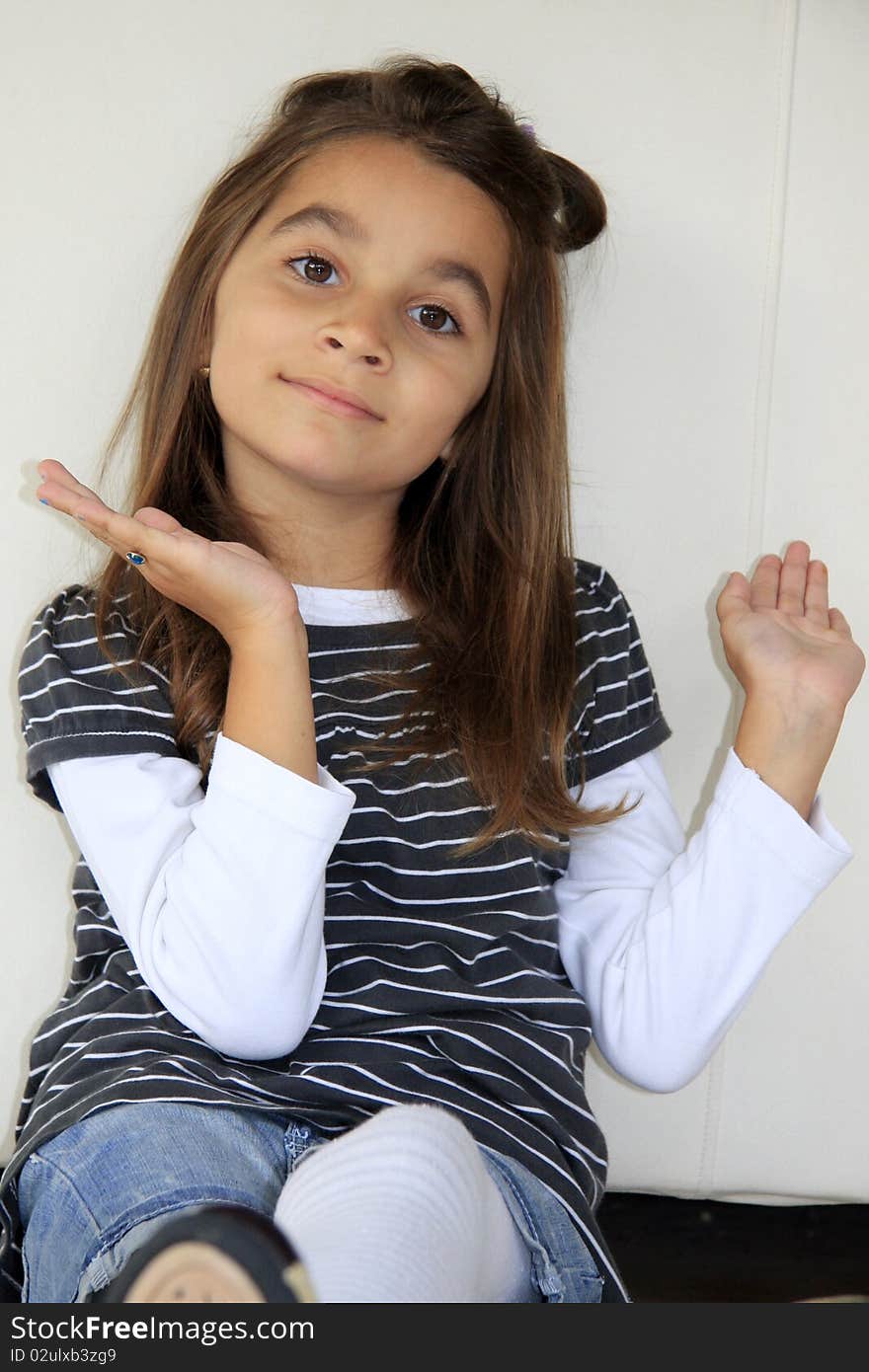 Young girl with big brown eyes likes pose in front of camera. She smiles always. Young girl with big brown eyes likes pose in front of camera. She smiles always.