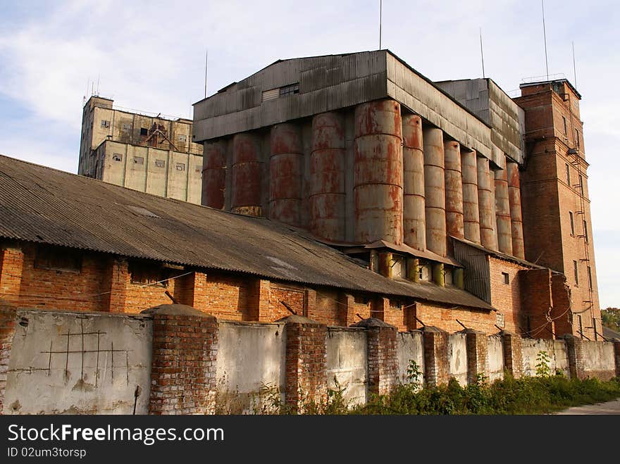 Agricultural grain elevator. An old industrial building in the East Europe.