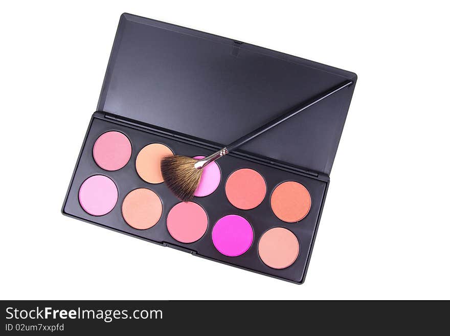 Professional make-up brush on eyeshadows palette, closed-up