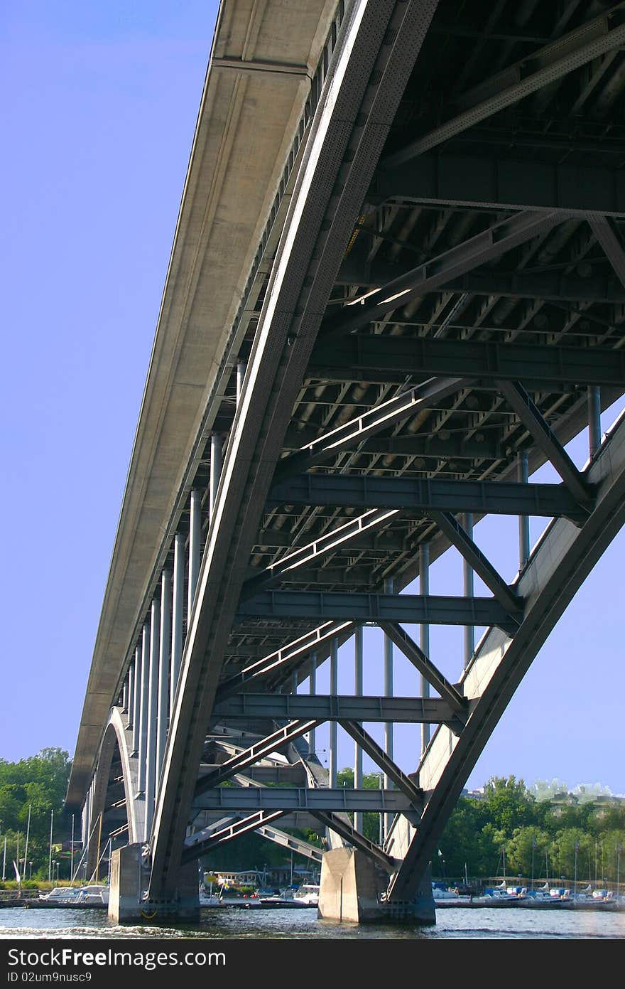 The iron Vasterbron Bridge in Stockholm seen from the water. The iron Vasterbron Bridge in Stockholm seen from the water