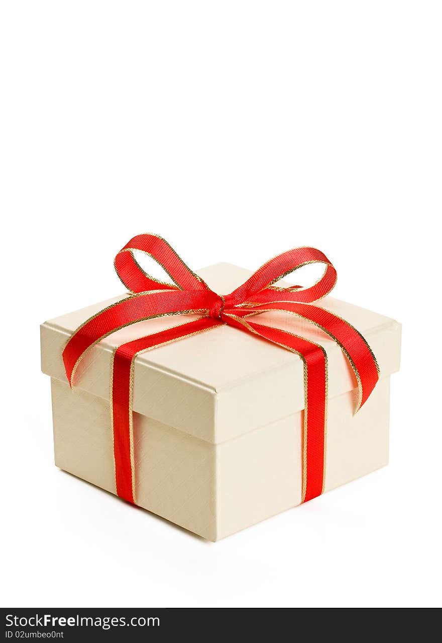 White gift box with red bow isolated on white background.