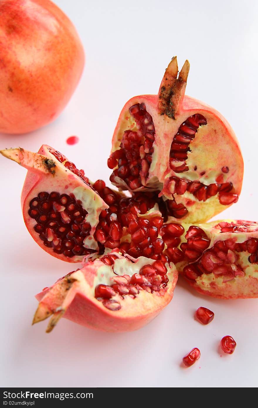 Red pomegranate fruit on the table