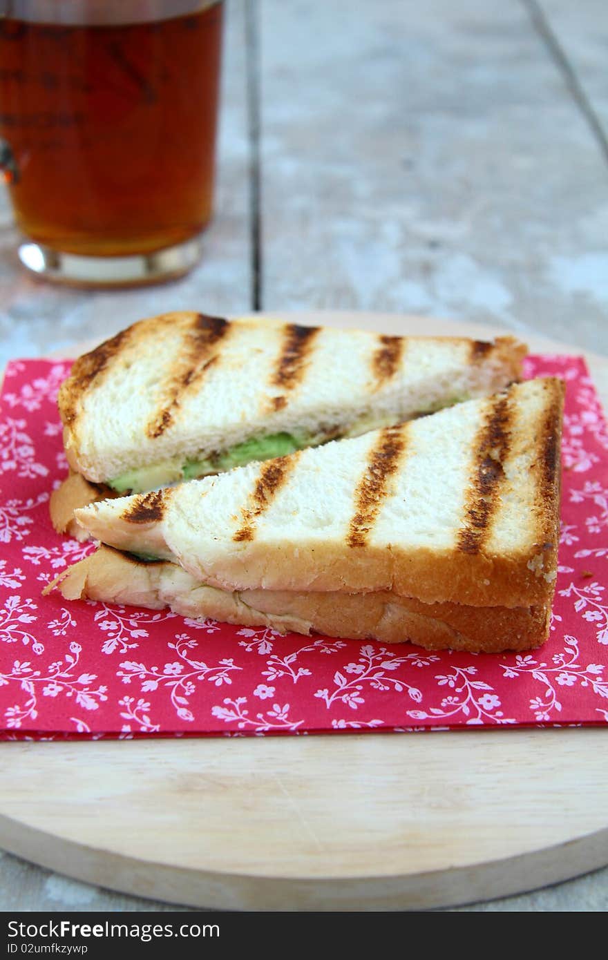 Sandwich with avocado on a red napkin