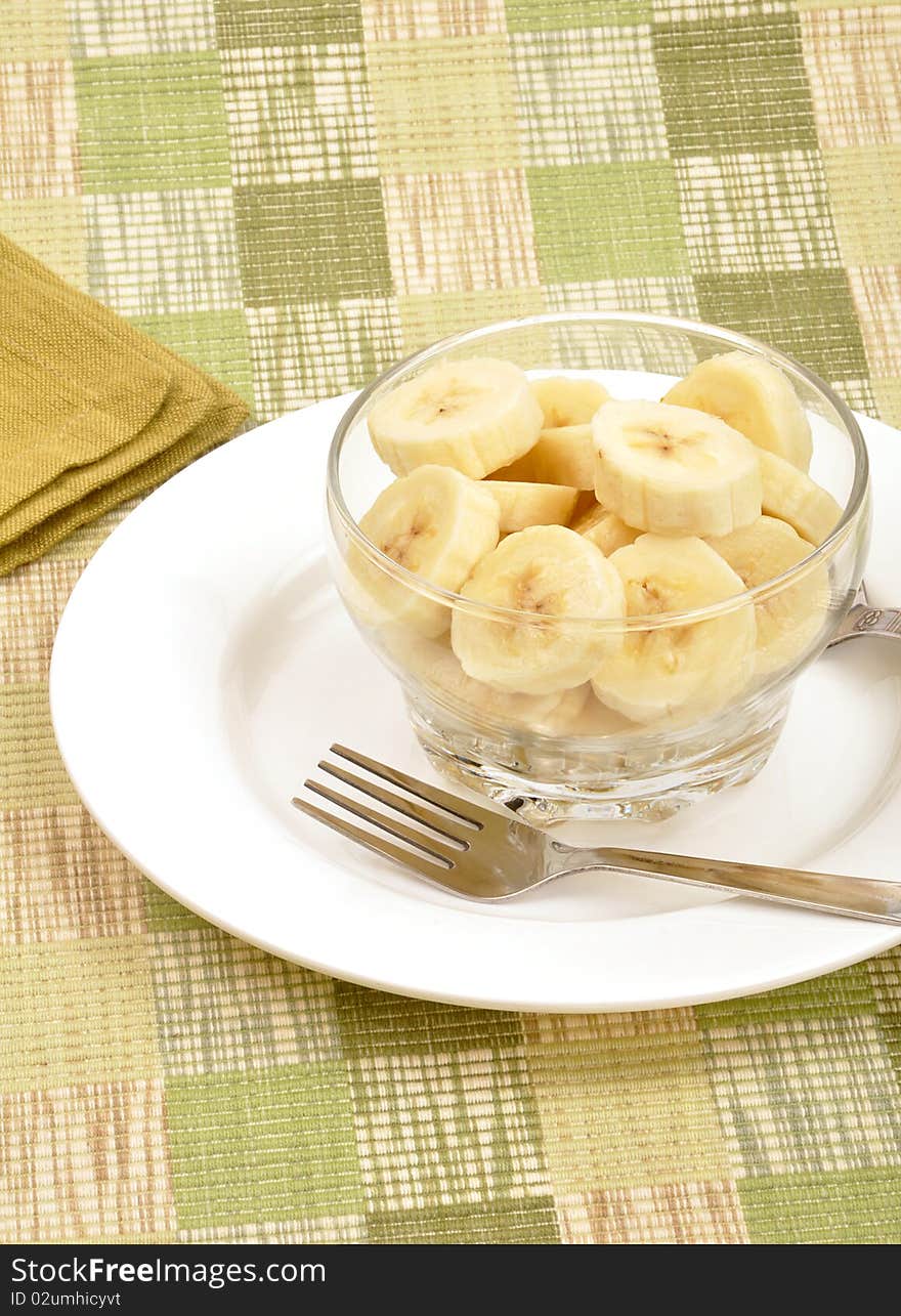 Fresh banana salad on textured background