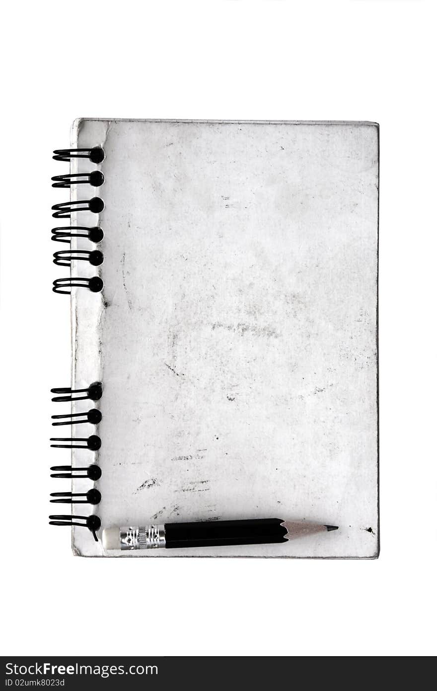 Dirty old spiral notepad and pencil on isolated on white