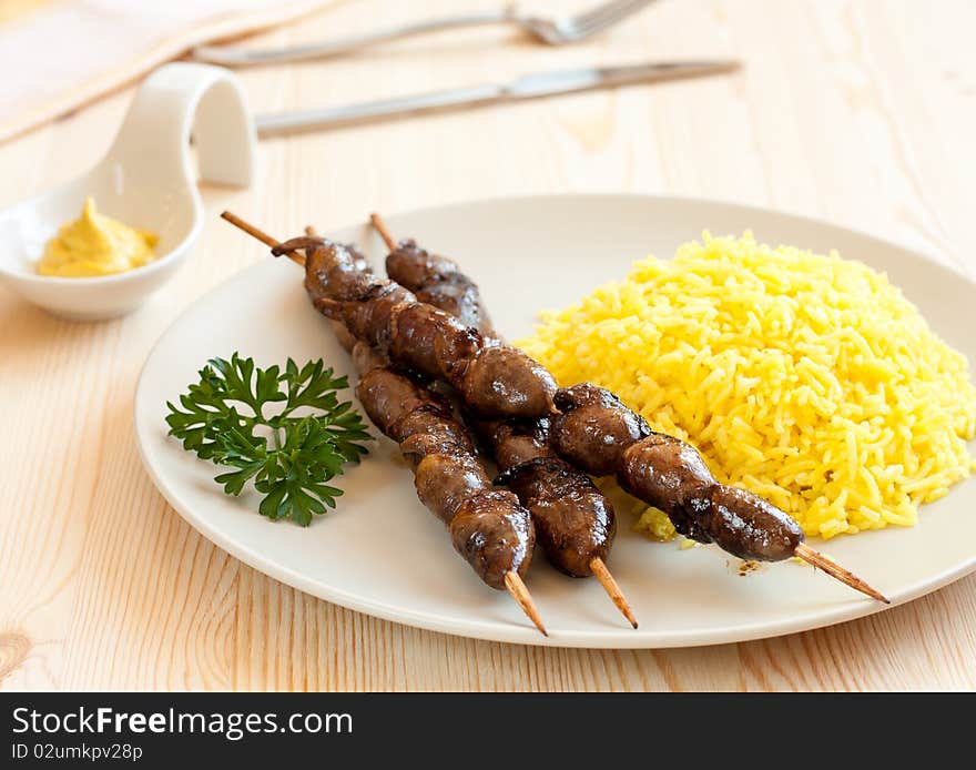 Grilled chicken hearts with turmeric rice