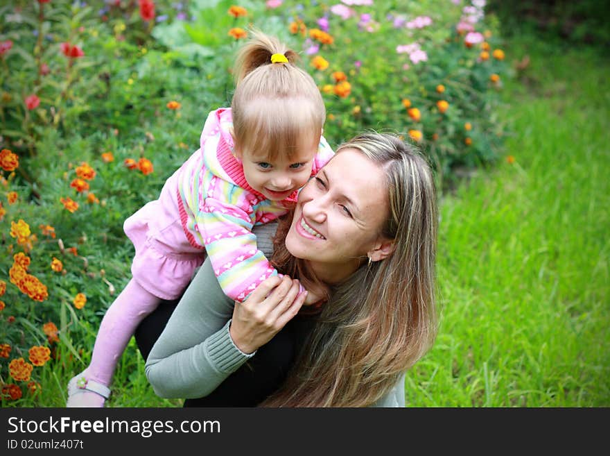 Girl with her mother in the garden