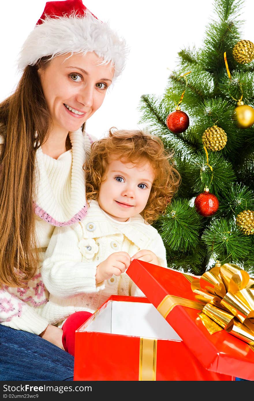 Mother and little daughter opening a present box. Mother and little daughter opening a present box