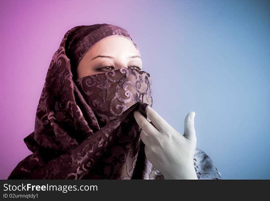 Arab veiled woman dressed lit with two lights