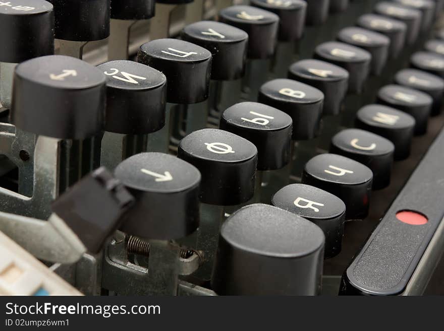 Closeup shoot of old typing device with Russian letters.