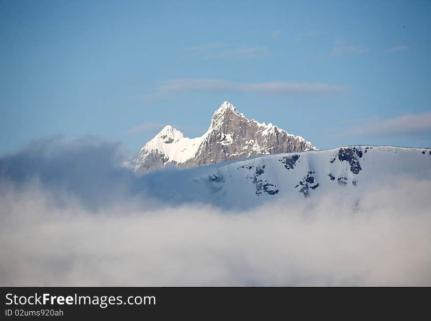 Mountain landscape - high mountains in clouds