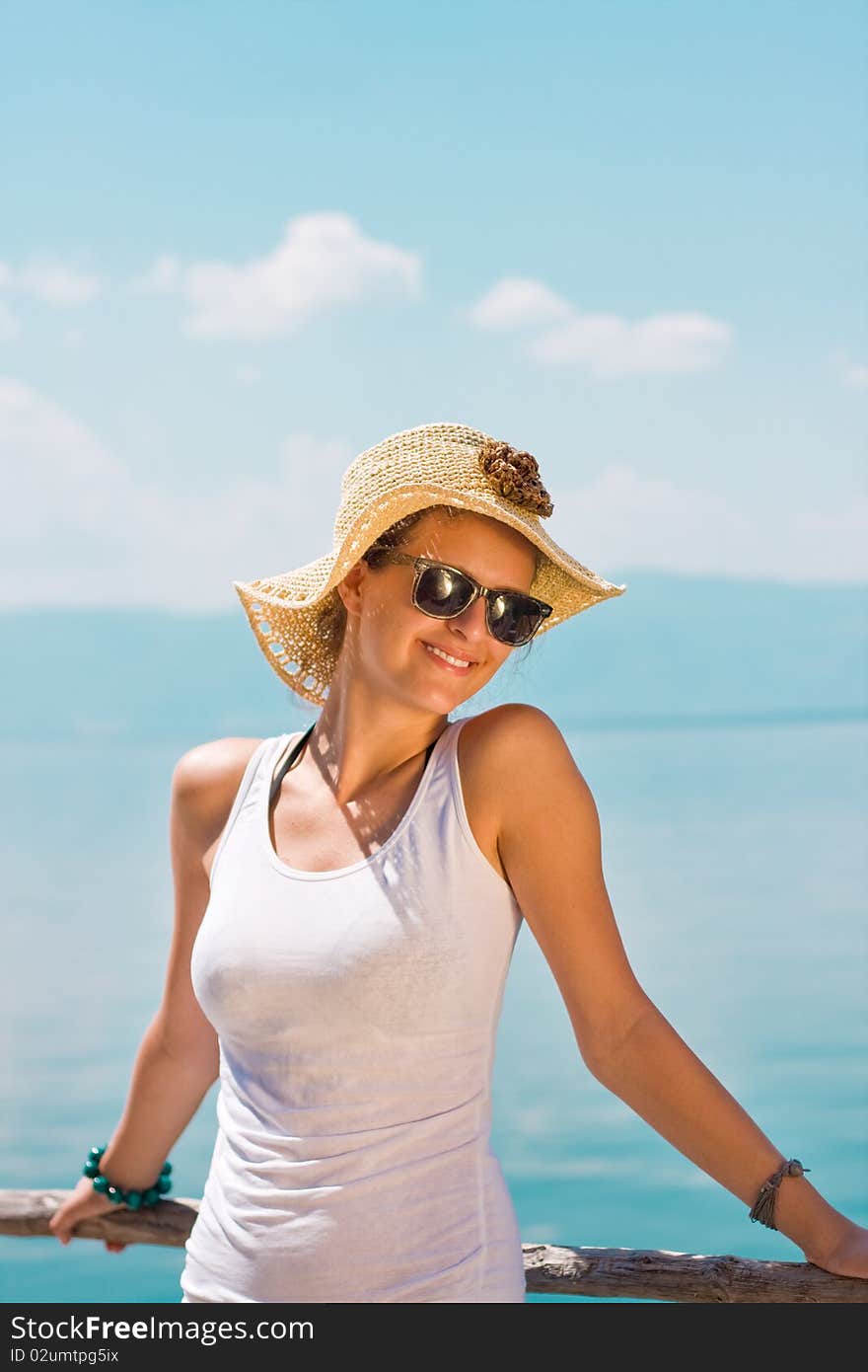 Happy young girl in white tank top