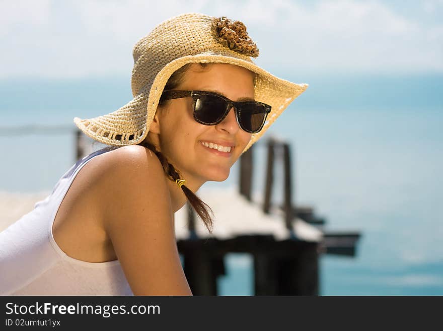 Happy young girl in white tank top