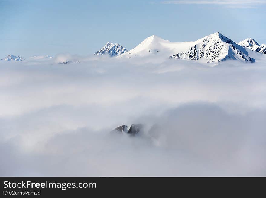 Mountain landscape - high mountains in clouds