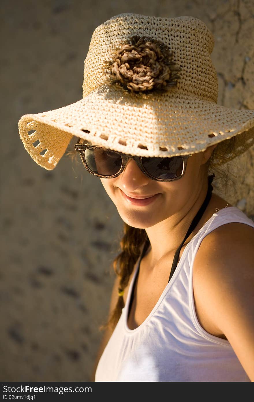 Happy young girl in white tank top