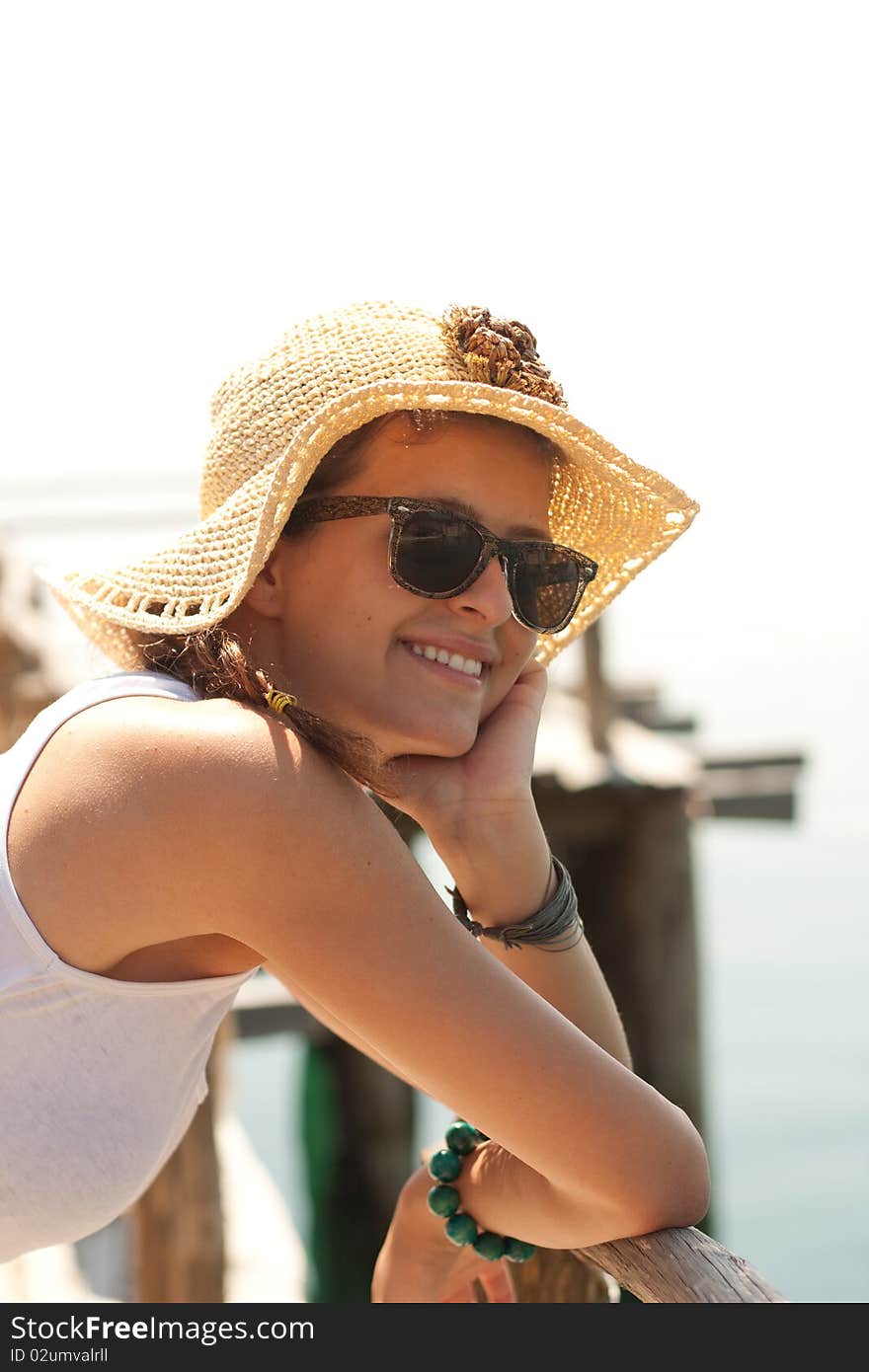 Happy young girl in white tank top