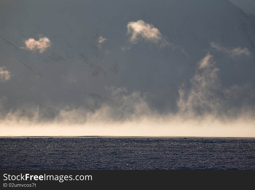 Arctic landscape - fog over the sea