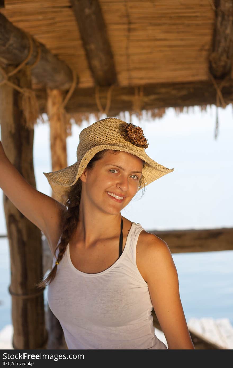 Happy young girl in white tank top