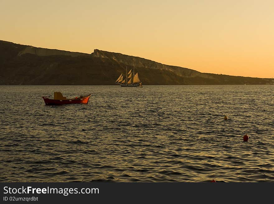 Sunset over port of Mykonos, Greece