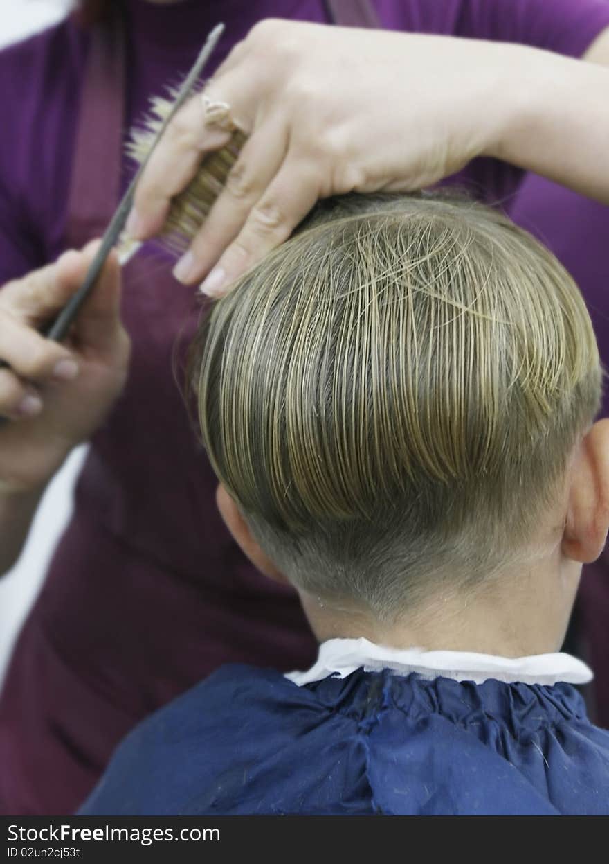 Portrait of boy getting haircut