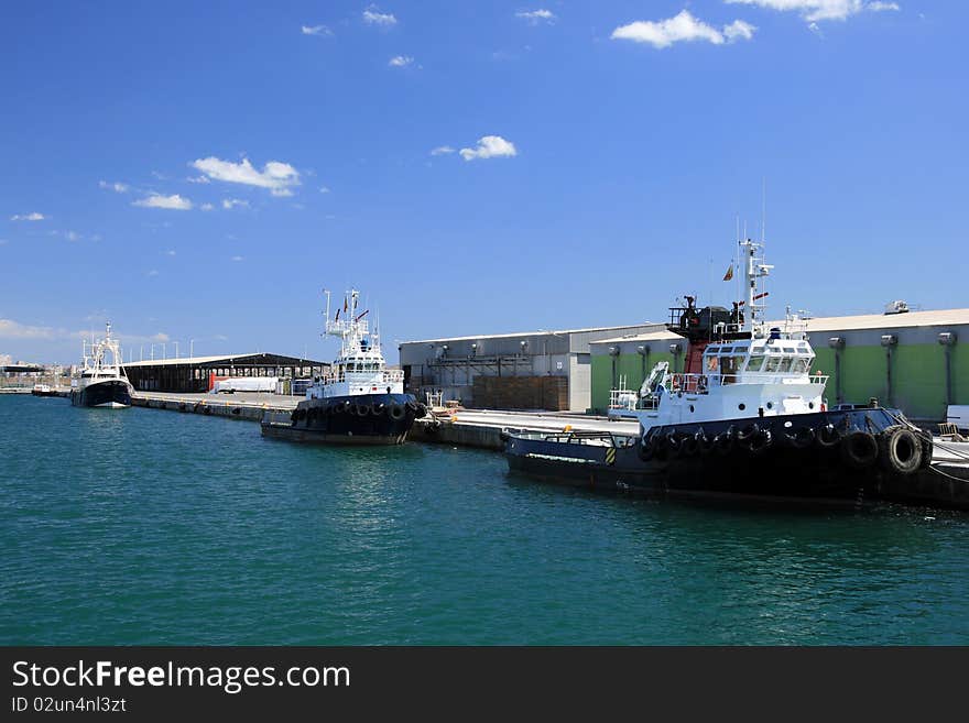 Tugs tied up in the port of Alicante