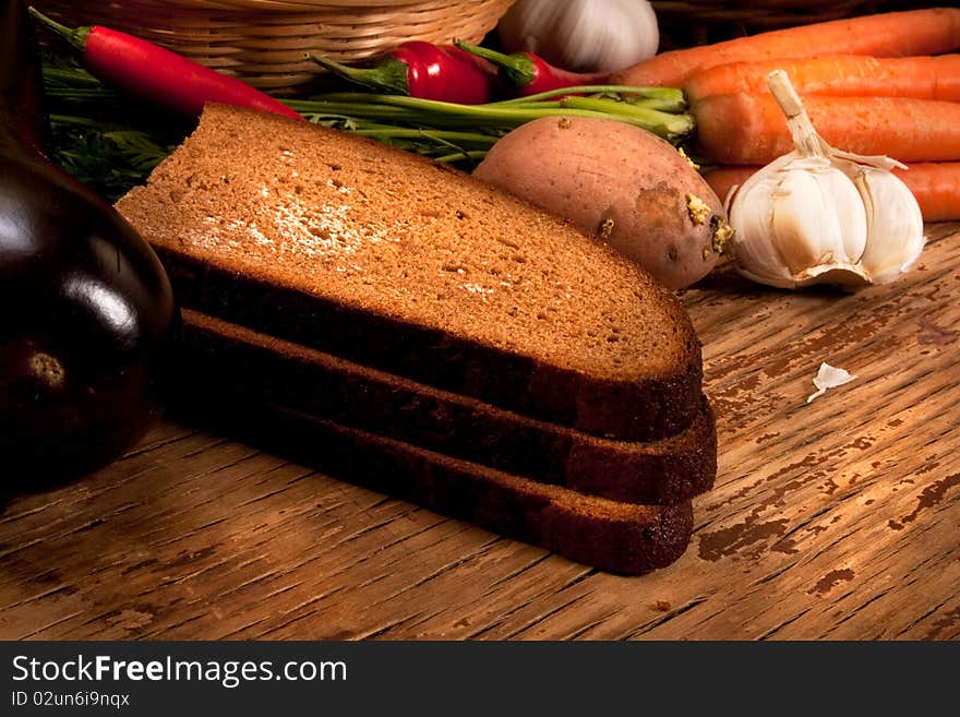 Different sorts of vegetables on rural background