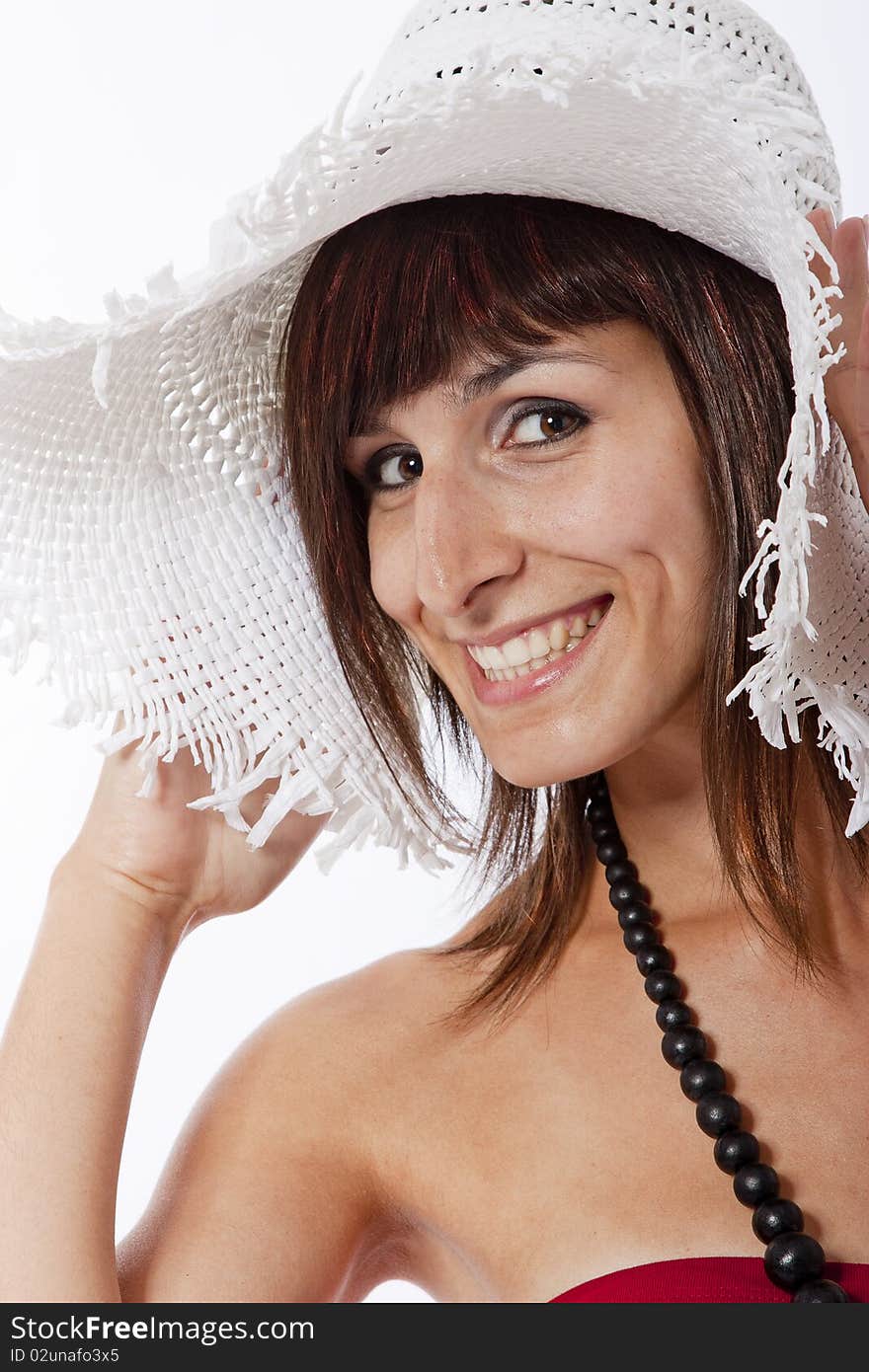 This photo shows a beautifull young girl doing poses on a white background.