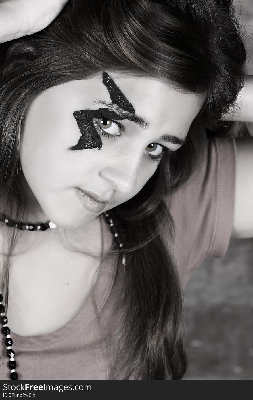 Toned image of teenager wearing halloween make-up. Toned image of teenager wearing halloween make-up