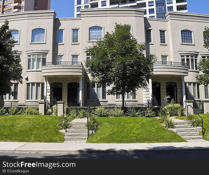 Row of upscale townhouses in urban setting. Row of upscale townhouses in urban setting