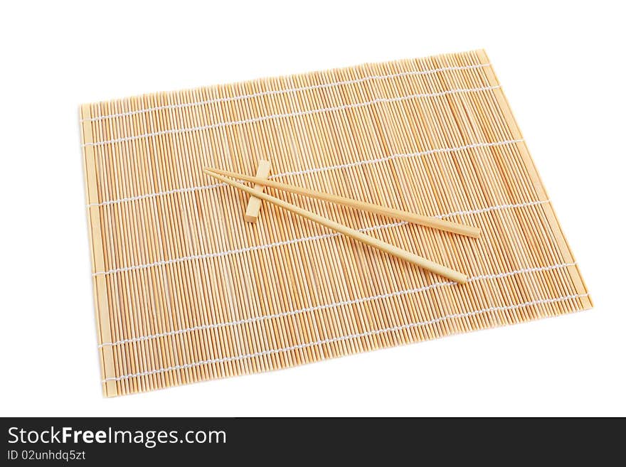 Chopsticks isolated on bamboo mat