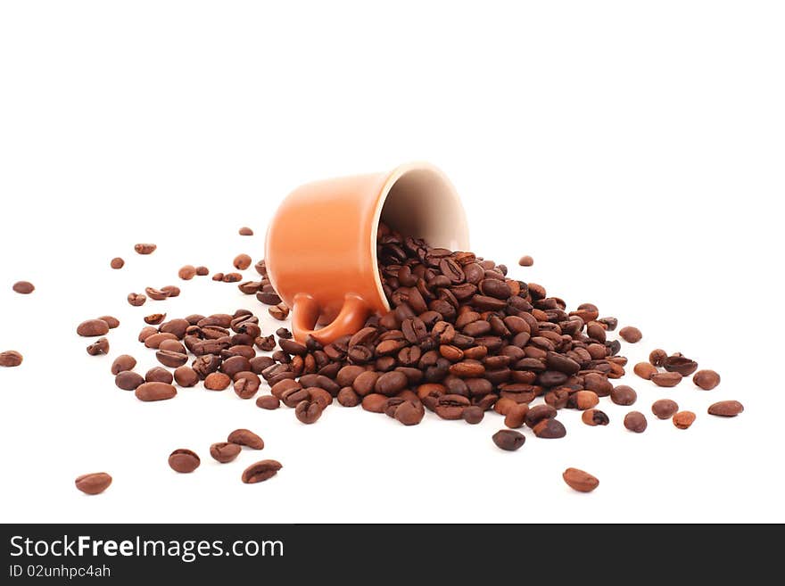 Cup And Coffee Beans Isolated Over White