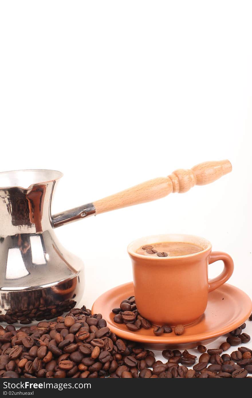 Turk and coffee cup on a white background