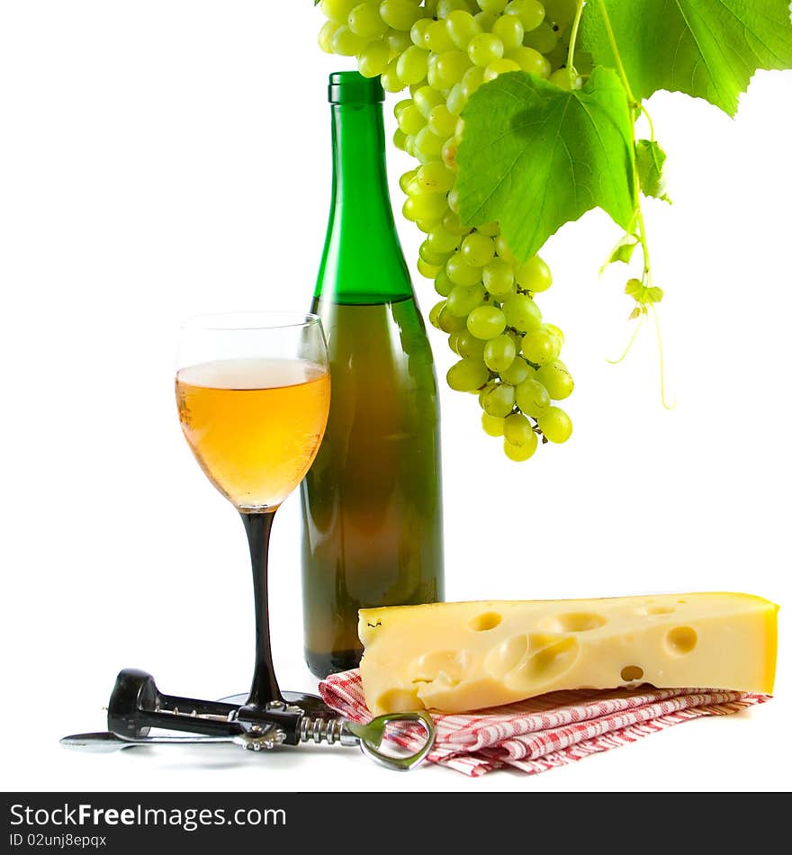 Bottle of wine, glass and grapes isolated on white