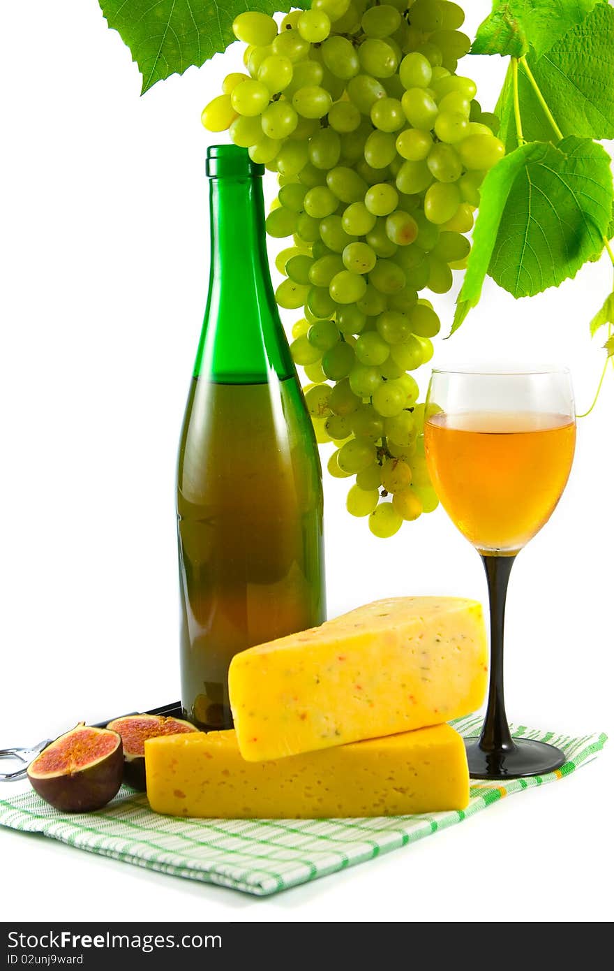 Bottle of wine, glass and grapes isolated on white