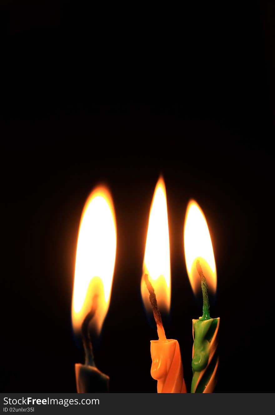 Candles isolated on black background